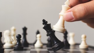 Plan leading strategy of successful business competition leader concept, Hand of player chess board game putting white pawn, Copy space for your text