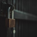 Closeup steel door with lock , padlock , key lock , dark background