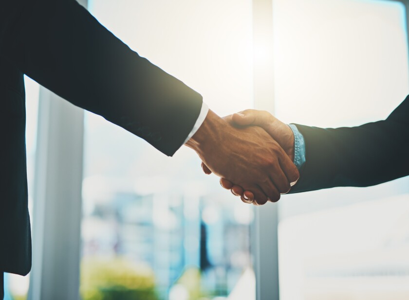 Business people, meeting and shaking hands for introduction, support and advice at law firm consultation. Lawyer, attorney or advisor with handshake for client deal, merger and welcome to partnership