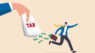 Tax evasion, illegal hide revenue and avoid paying government tax, fraud and money laundering or financial crime concept, frustrated businessman run away with full of money banknotes from tax bills.