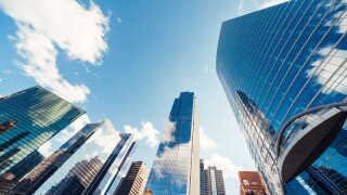 Modern tower buildings or skyscrapers in financial district with cloud on sunny day in Chicago, USA. Construction industry, business enterprise organization, or communication technology concept