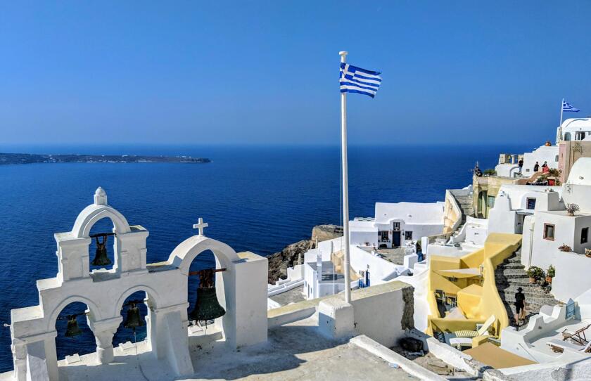 Greek flag over the sea