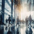 Blurred group of busy business people moving through a corporate office space