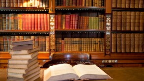 Old classic library with books on table