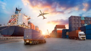 Container truck in ship port for business Logistics and transpor