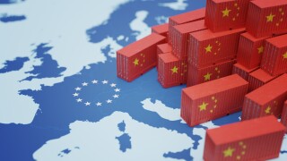 Chinese cargo containers on map of Europe. Import of chenese goods concept. 3D rendered illustration.
