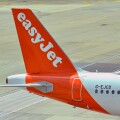 London, England, UK - 1 August 2023: Tail fin of an Airbus A320 passenger jet operated by budget airline easyjet (registration G-EJCD) at London Gatwick airport