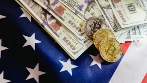 Bitcoin physical coins on American flag background with dollars 