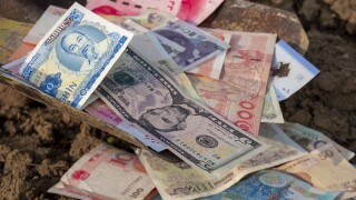 Shovel full of money