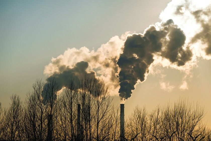 thick smoke belching from factory chimneys