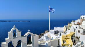 Greek flag over the sea