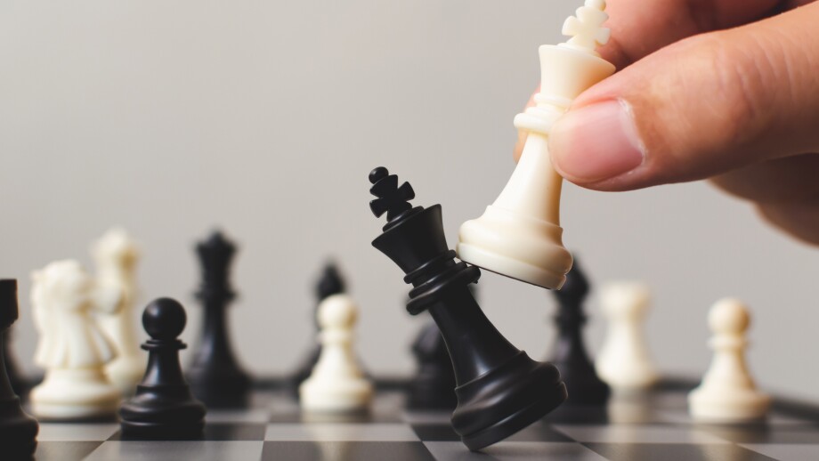 Plan leading strategy of successful business competition leader concept, Hand of player chess board game putting white pawn, Copy space for your text