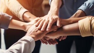 Creative business team putting their hands together. Generative AI