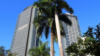 MANILA, PHILIPPINES - NOVEMBER 28, 2017: Ayala Tower One (left) skyscraper in Makati City, Metro Manila, Philippines. The building is headquarters for Philippine Stock Exchange.
