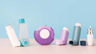 Set of asthma inhalers for asthma and COPD patients on table. Ph