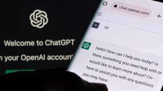 ChatGPT chat bot screen seen on smartphone and laptop display wi