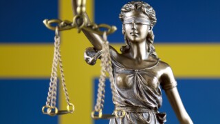 Symbol of law and justice with Sweden Flag. Close up.