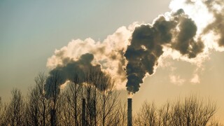 thick smoke belching from factory chimneys