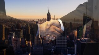 Handshake on city backdrop