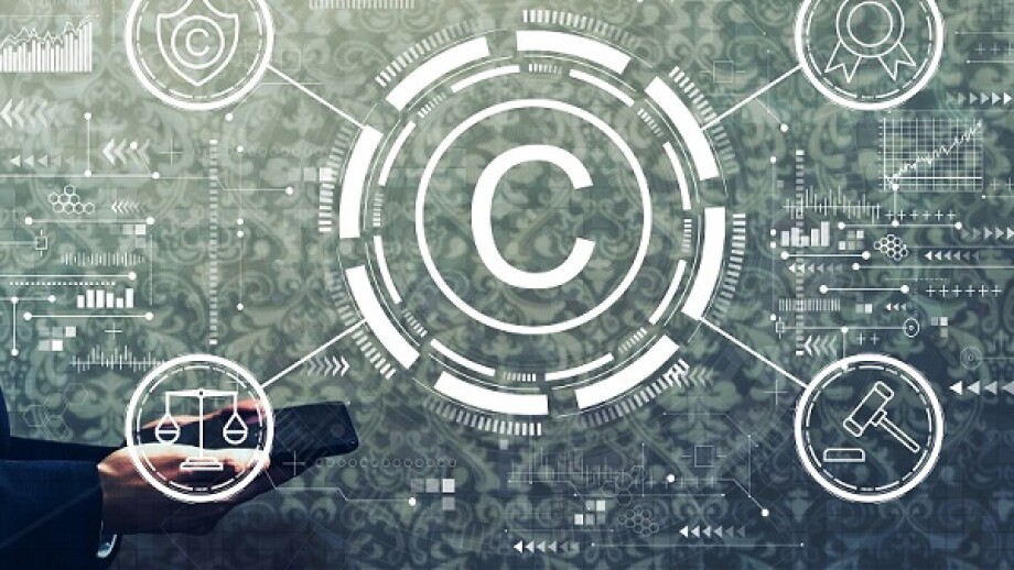 Copyright concept with businessman holding a tablet