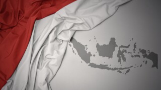 waving colorful national flag and map of indonesia.
