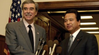 Carlos Gutierrez (left) and Akira Amari