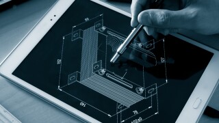 engineer working on computer on electrical piece design