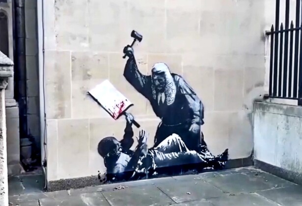 British_street_artist_Banksy_has_painted_a_mural_on_London's_High_Court_depicting_a_judge_beating_a_protester.jpg