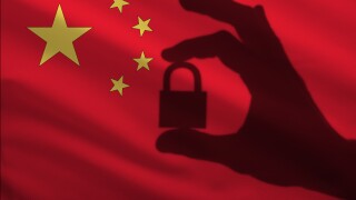 China closed lock in the hand. Import and export of goods from the world market of trade is prohibited. Closed borders for tourists and immigrants. Epidemic virus Top Secret Information