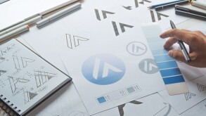 Graphic designer development process drawing sketch design creative Ideas draft Logo product trademark label brand artwork. Graphic designer studio Concept.