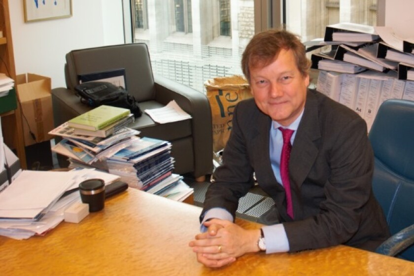 Colin Birss in his office at the Rolls Building in London