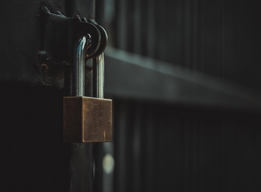 Closeup steel door with lock , padlock , key lock , dark background
