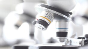 Set of microscopes standing in row in school chemist classroom