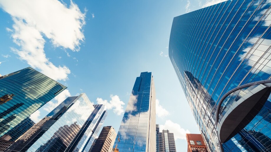 Modern tower buildings or skyscrapers in financial district with cloud on sunny day in Chicago, USA. Construction industry, business enterprise organization, or communication technology concept