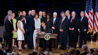 President Barack Obama signs in the Dodd-Frank Wall Street Reform and Consumer Protection Act in July 2010