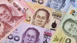 Thai Baht, a business background with money from Thailand