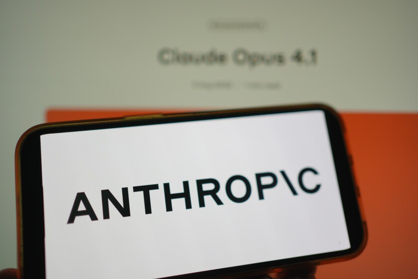 Roosendaal, The Netherlands - August 05, 2025: A mobile phone displaying the logo of Anthropic, with the company website, displaying the new Claude Opus 4.1 model in the background.