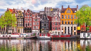 Amsterdam Netherlands dancing houses over river Amstel landmark