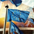 EU flags waving in front of European Parliament building. Brusse