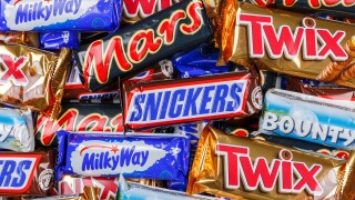 Products of Mars Inc. company like Snickers, Twix, Milky Way and Bounty chocolate bars background banner