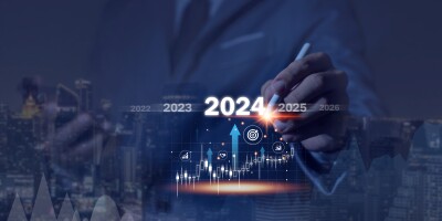 Countdown to 2024 concept. the taps a virtual download bar with a loading progress meter on New Year's Eve, turning the year 2024 to 2025.