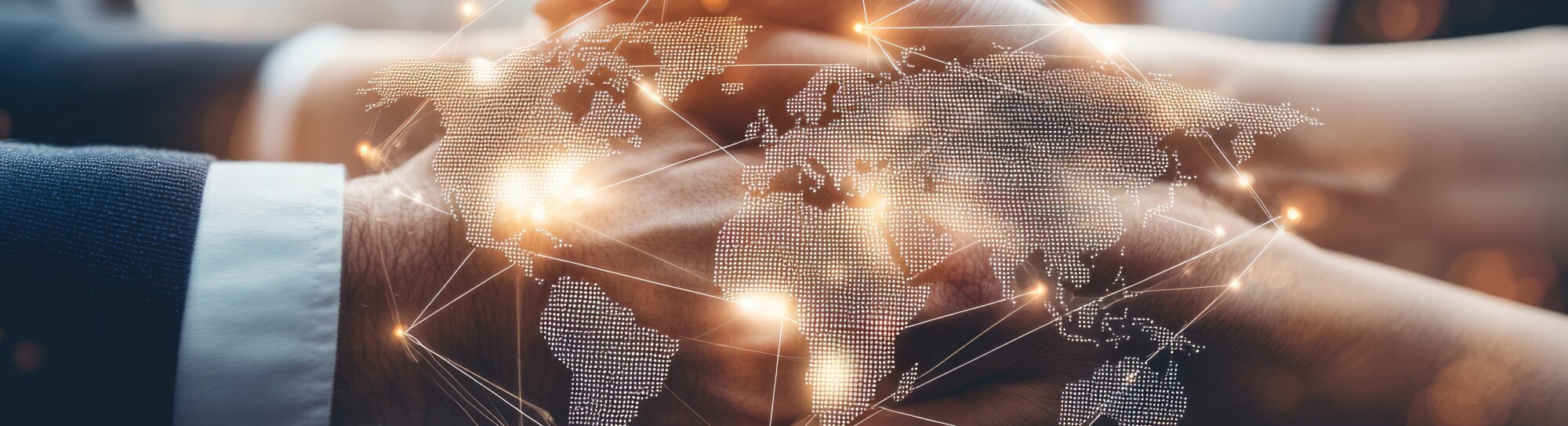 Map with connecting networks against a background of shaking hands