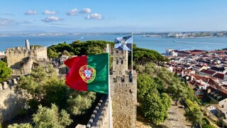 Portuguese skyline with flag at forefront.jpg