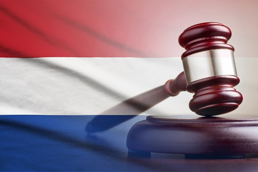 Legal gavel over a flag of the Netherlands