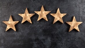 Five stars on dark background