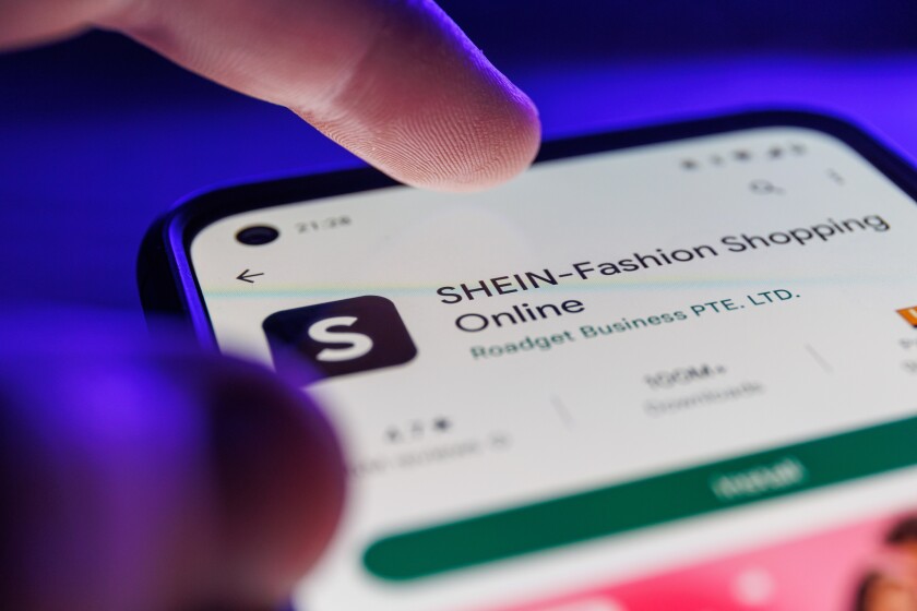 Shein app on smartphone screen. Close up shot of Shein app