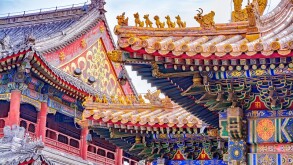 Chinese traditional architecture -  colorful ornament and statue dragons on roof of Lama Temple in Beijing, China