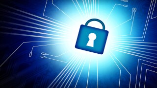 Cyber security concept - Padlock in computer screen over motherb