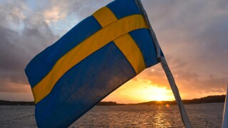 Swedish flag against sunset.jpg