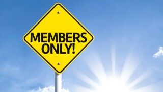 Members Only road sign with sun background